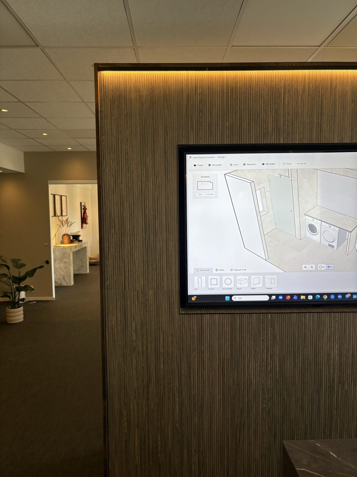 3D-ritning av badrum visad på skärm i vårt showroom i Göteborg